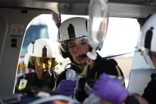 Decorative image of someone in helicopter giving care